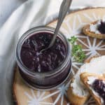 Crostini platter with a jar of blueberry-onion jam